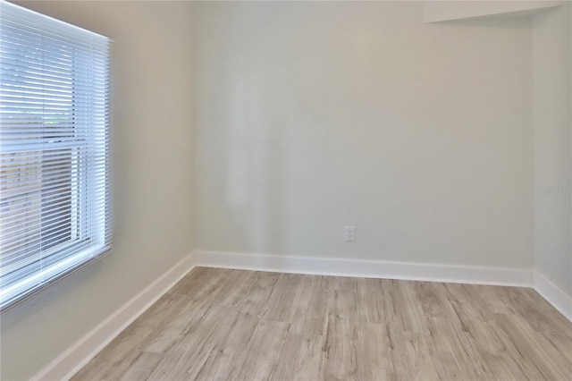 spare room featuring light hardwood / wood-style flooring