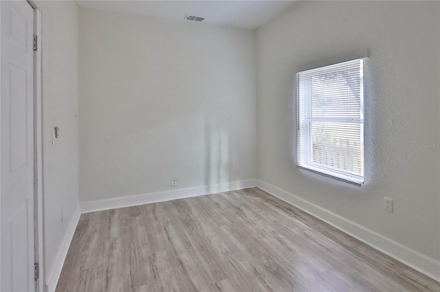 unfurnished room featuring light wood-type flooring