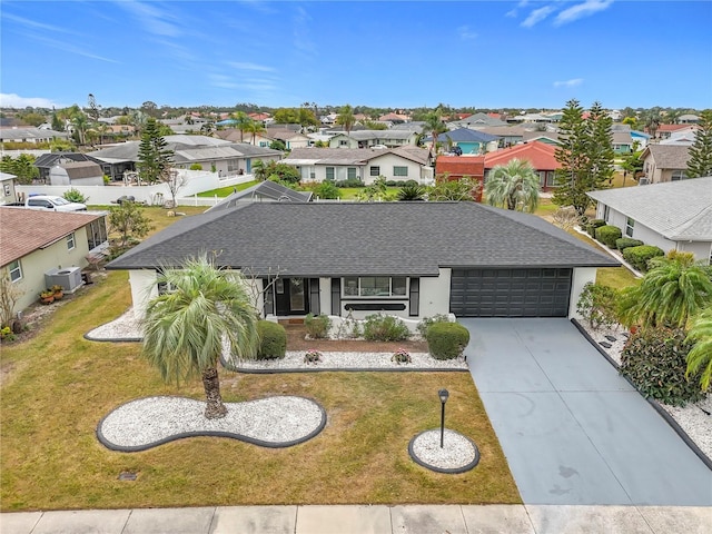 view of front of house featuring a garage and a front yard