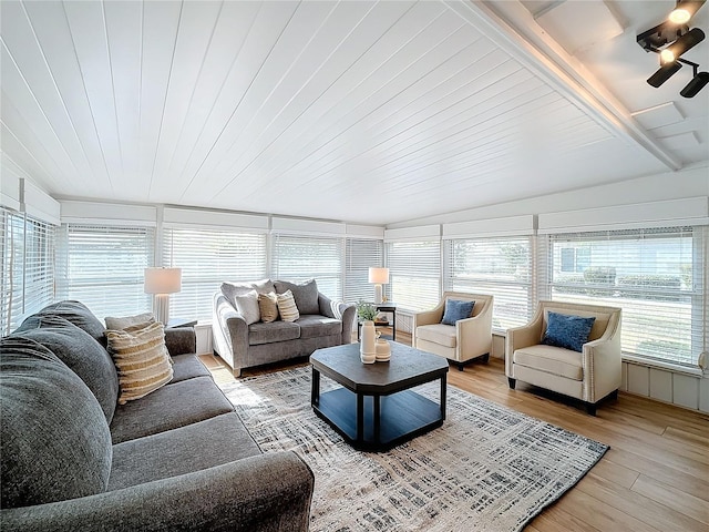 sunroom / solarium with ceiling fan and wood ceiling