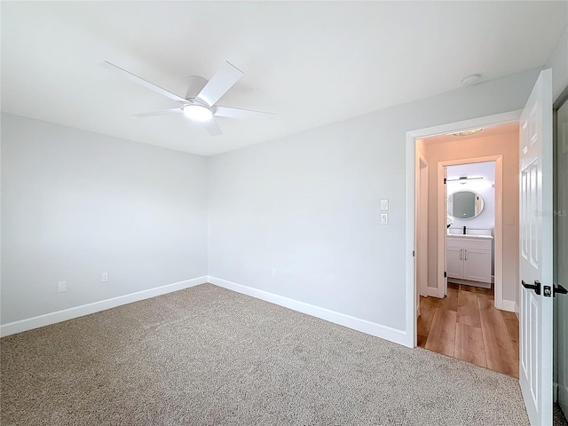 carpeted empty room with ceiling fan