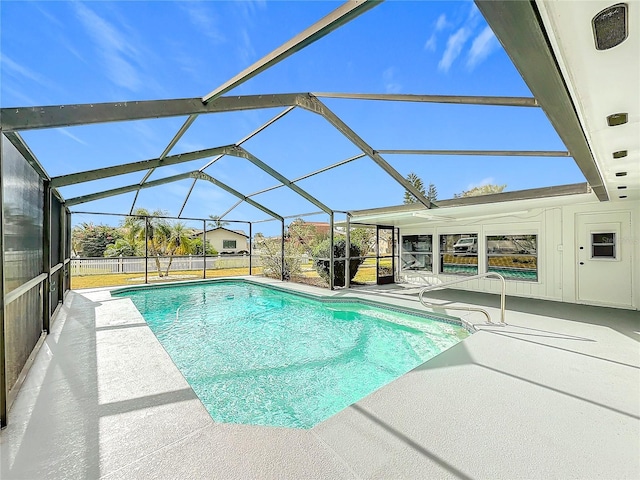 view of pool with a lanai and a patio