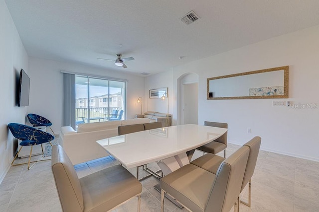 dining area featuring ceiling fan and light tile patterned floors