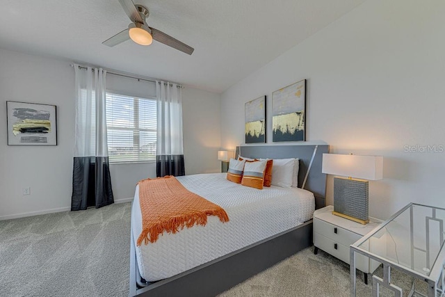 bedroom with light colored carpet and ceiling fan