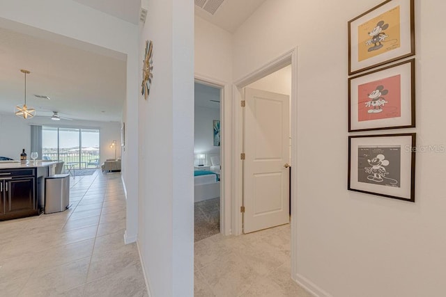 hallway with light tile patterned floors