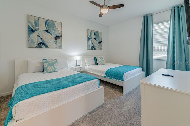 carpeted bedroom featuring ceiling fan