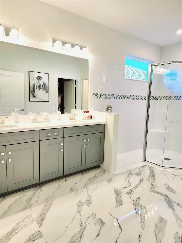 bathroom with vanity and tiled shower