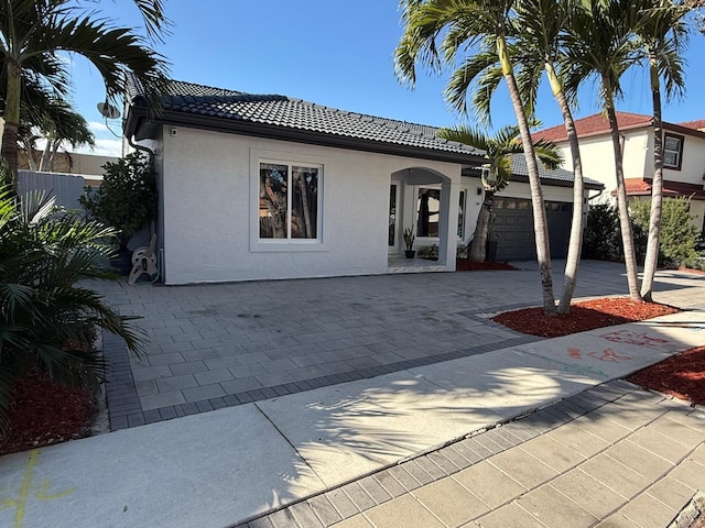 mediterranean / spanish-style house featuring a garage