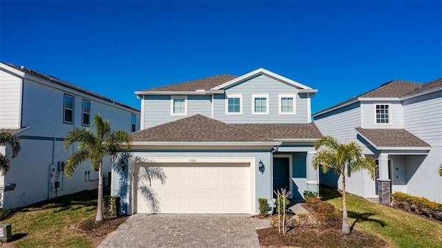 front of property with a garage