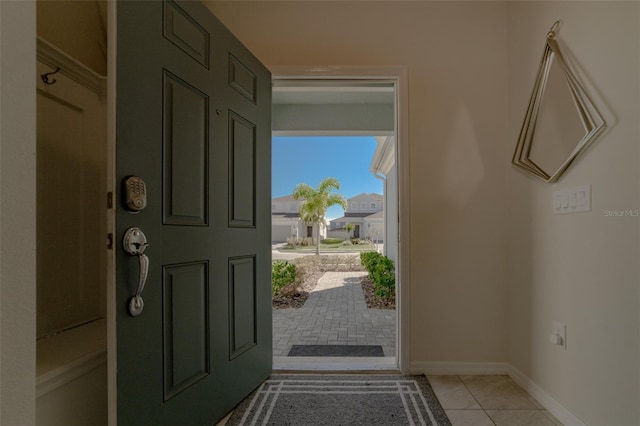 foyer entrance featuring light tile patterned floors