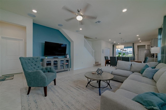 tiled living room with ceiling fan