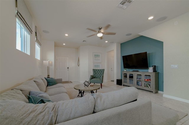 tiled living room featuring ceiling fan