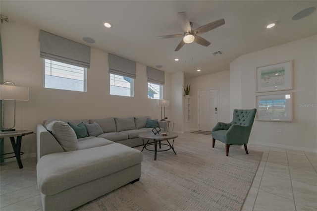 tiled living room featuring ceiling fan