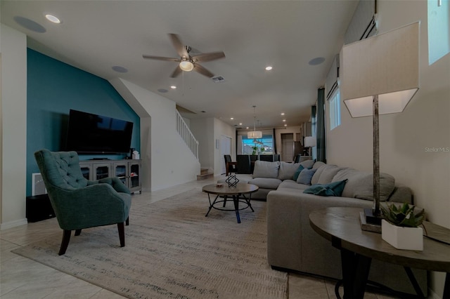 living room featuring ceiling fan and light tile patterned flooring