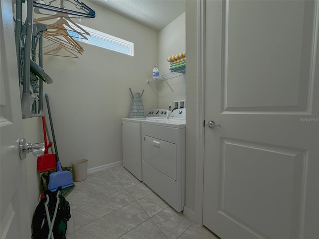 laundry room featuring washing machine and clothes dryer