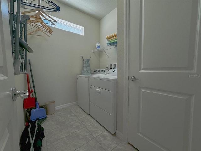1166 Aloha Blvd, Davenport, FL 33897 - laundry room with washing machine and clothes dryer and light tile patterned floors