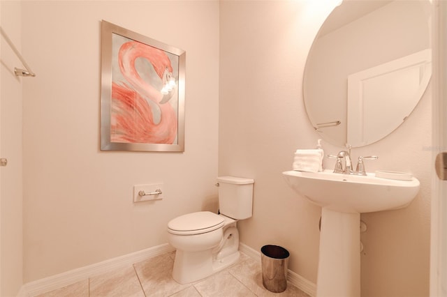 bathroom with tile patterned flooring and toilet