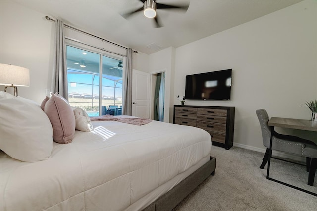 carpeted bedroom featuring access to exterior and ceiling fan