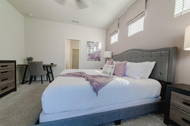 bedroom featuring light carpet and ceiling fan