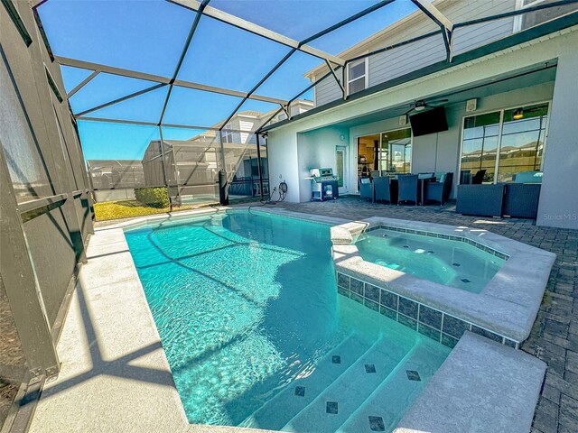 1166 Aloha Blvd, Davenport, FL 33897 - view of swimming pool featuring a patio, ceiling fan, a pool with connected hot tub, a lanai, and outdoor lounge area