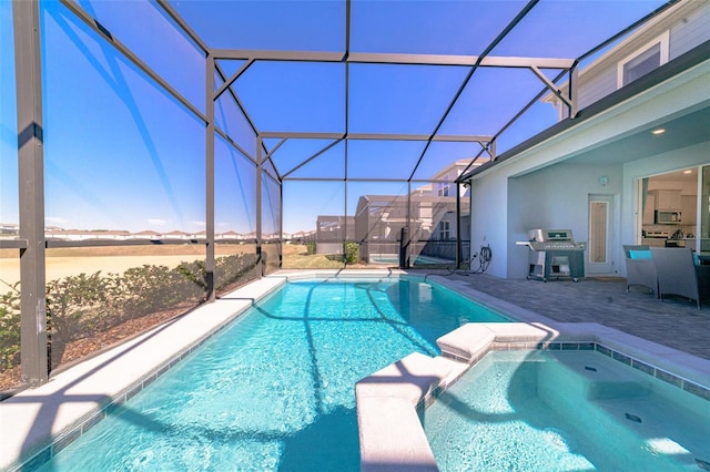 view of pool featuring a patio, a lanai, and a grill