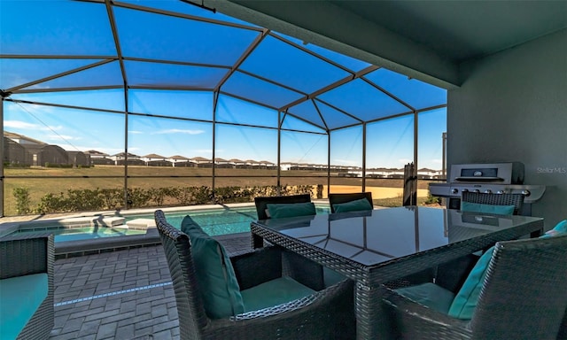 view of patio / terrace featuring a lanai