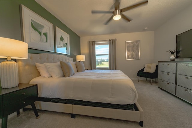 carpeted bedroom featuring ceiling fan