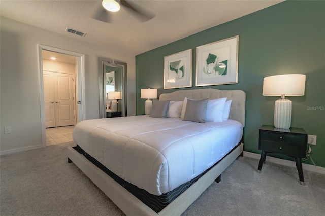 bedroom featuring ceiling fan and light colored carpet