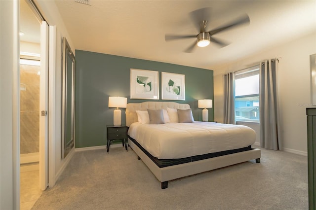 carpeted bedroom featuring connected bathroom and ceiling fan