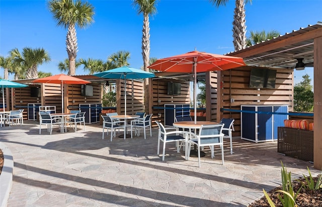 view of patio featuring ceiling fan