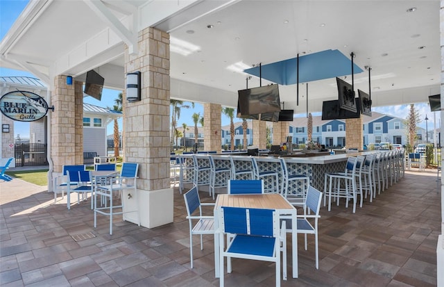 view of patio with an outdoor bar