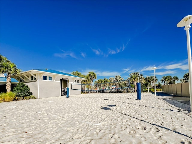 view of front of house with volleyball court