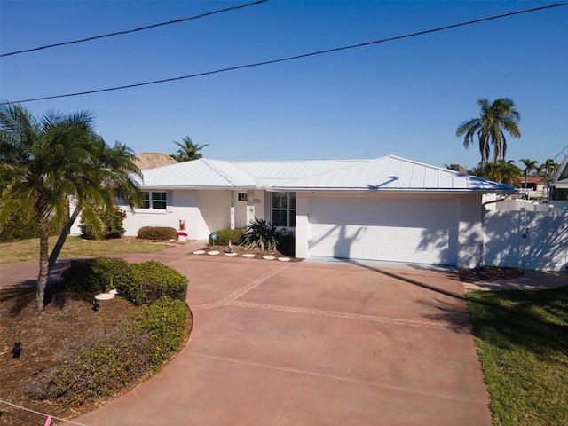 ranch-style house featuring a garage