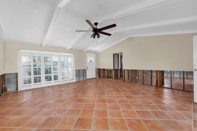 interior space featuring light tile patterned floors, vaulted ceiling with beams, and ceiling fan