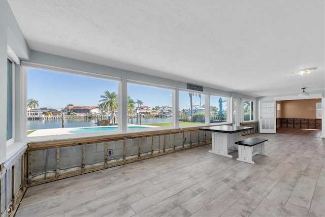 sunroom with a water view