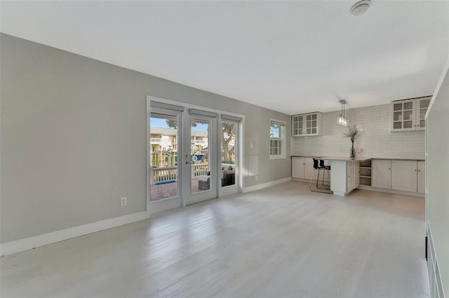 unfurnished living room with french doors