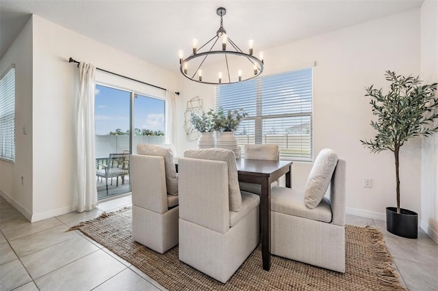 tiled dining area with a notable chandelier