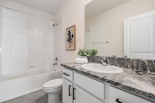 full bathroom with tile patterned flooring, vanity,  shower combination, and toilet