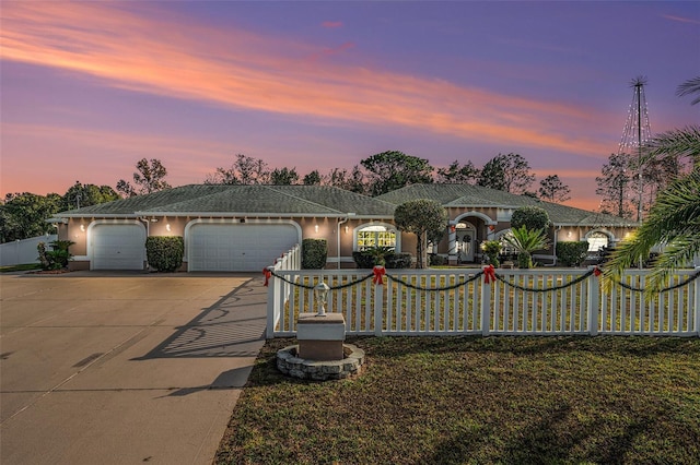 ranch-style home with a garage