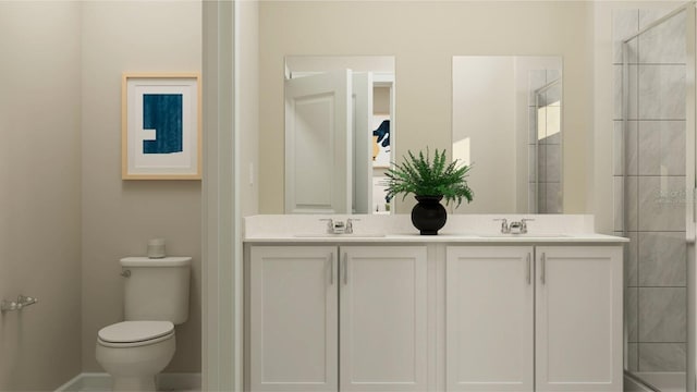 bathroom featuring vanity, an enclosed shower, and toilet