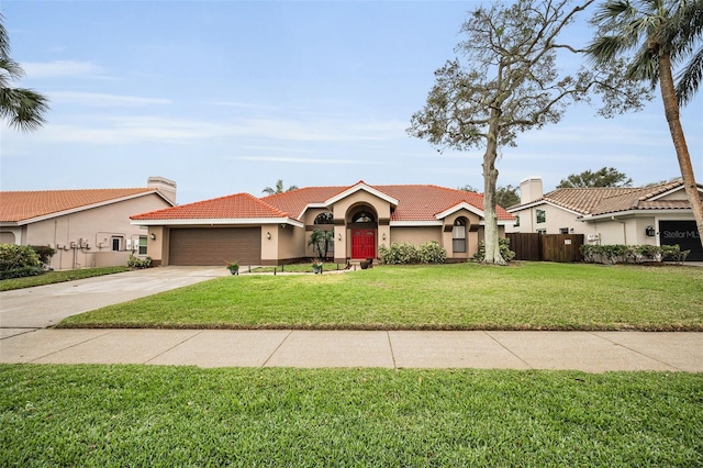 ranch-style home with a garage and a front yard