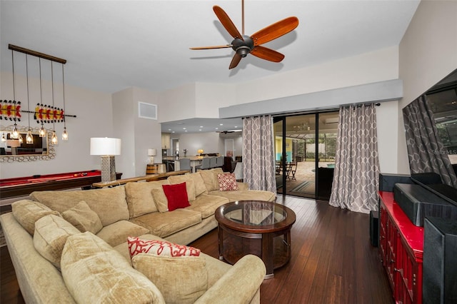 living room featuring dark hardwood / wood-style floors, ceiling fan, and billiards