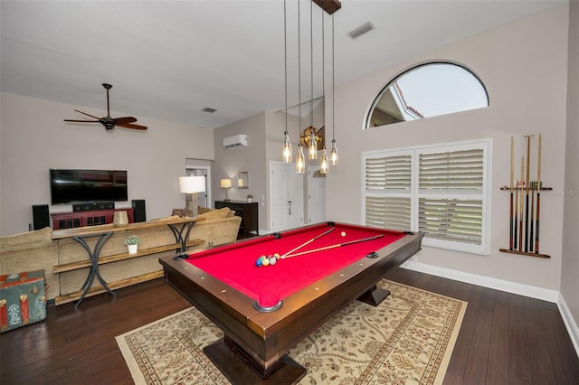 rec room featuring dark hardwood / wood-style flooring, pool table, an AC wall unit, and ceiling fan