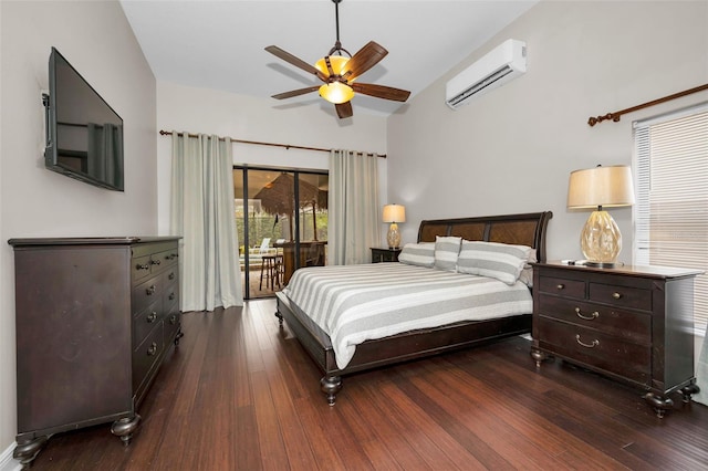 bedroom featuring a wall mounted air conditioner, dark wood-type flooring, access to outside, and ceiling fan