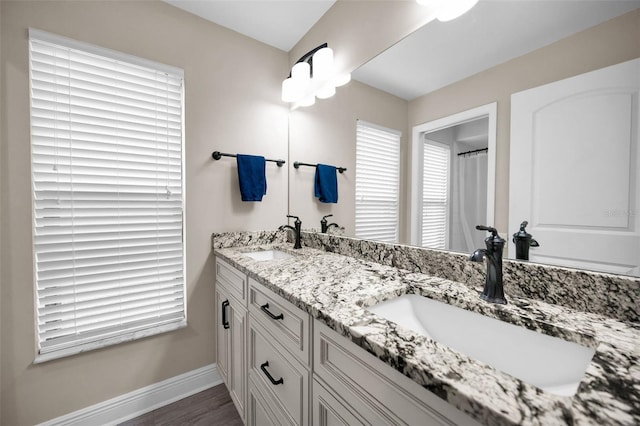 bathroom featuring vanity and wood-type flooring