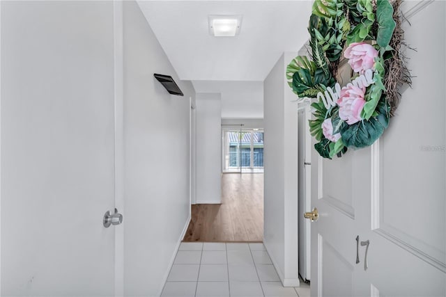 hall with light tile patterned flooring