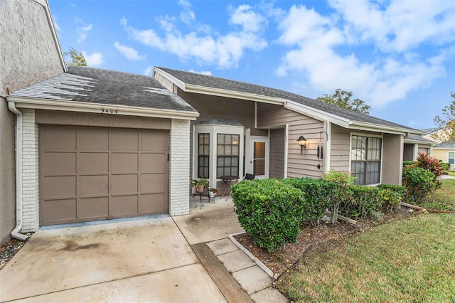 single story home with a garage