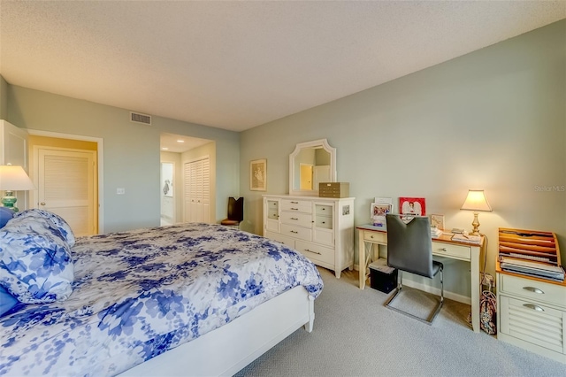 bedroom featuring a closet and light colored carpet