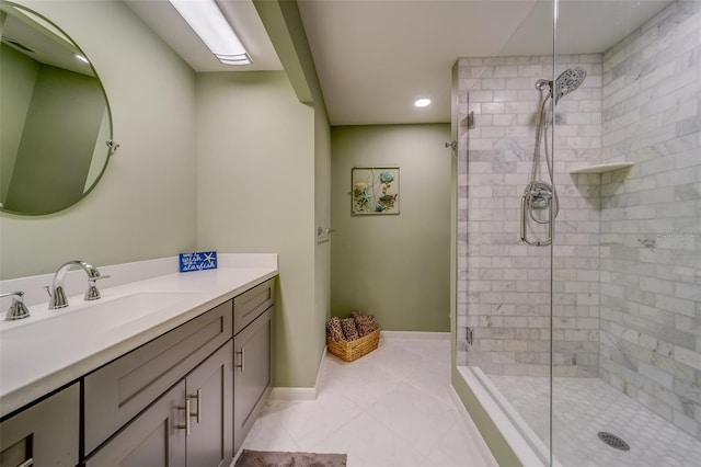 bathroom featuring tile patterned floors, vanity, and an enclosed shower