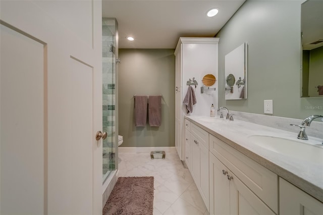 bathroom with vanity, an enclosed shower, and toilet